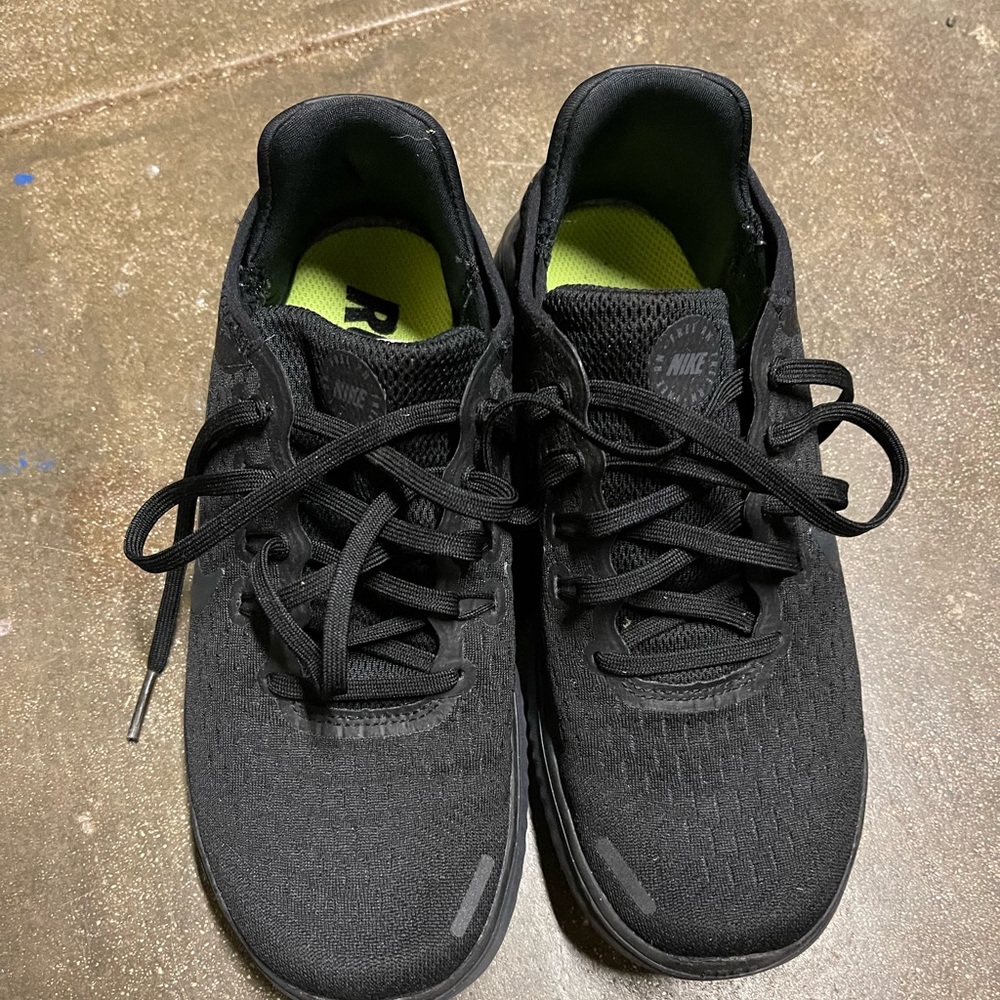 All black Nike Free running shoes